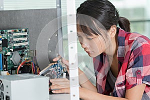 Female engineer working with circuits