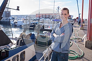 female engineer working in harbor background photo
