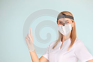 Female ENT doctor, wearing in mask at the hospital