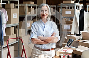 Female entrepreneur clothing store business owner in warehouse, portrait. photo