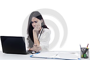 Female entrepreneur looks stressed on studio