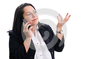 Female entrepreneur making confused gesture while talking phone