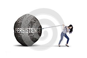 Female entrepreneur pulling persistence word on studio photo