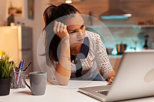 Female entrepreneur reading emails photo