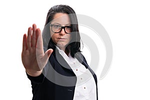 Female entrepreneur with serious expression making stop gesture