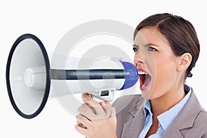 Female entrepreneur yelling through megaphone