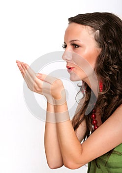 Female expressing kindness by blowing kisses photo