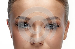 Female Eye with Extreme Long False Eyelashes. Eyelash Extensions. Makeup, Cosmetics, Beauty. Close up, Macro.