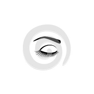 Female eye with long eyelashes and eyebrow black vector icon.