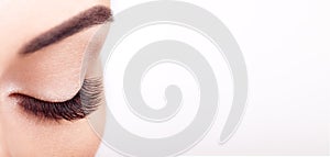 Female eye with long false eyelashes