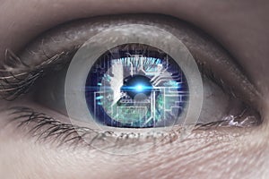 Female eye with overlay of printed circuit board. Concepts of Artificial intelligence development or Microchip implants