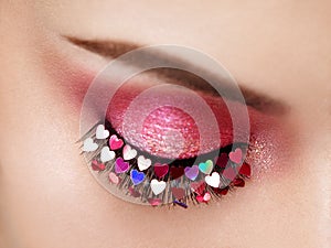 Female eye with Valentine`s day makeup