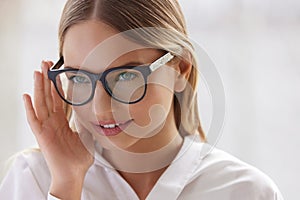 Female Eyeglasses. Portrait Of Young Woman Wearing Fashion Eyewear