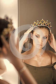 Female Face. Issues affecting girls. Girl princess and reflection in mirror. Woman wear jewelry crown at mirror. Beauty