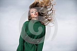 Female face portrait. Attractive young woman movement hair, portrait closeup. Sexy female model posing in studio