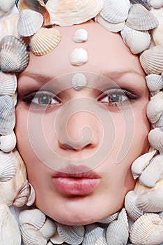 Female face with seashel