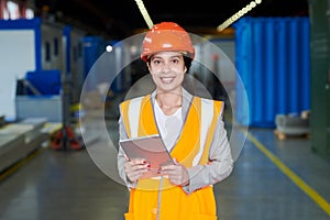 Female Factory Worker in Orange Uniform