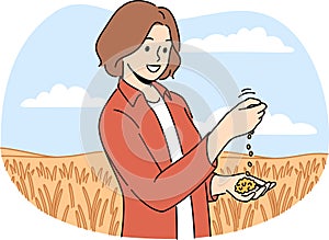 Female farmer inspect crops in field