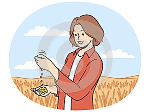 Female farmer inspect crops in field