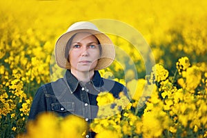 Female Farmer in Oilseed Rapeseed Cultivated Agricultural Field