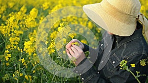 Female Farmer in Oilseed Rapeseed Cultivated Agricultural Field