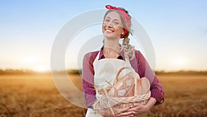 Female farmer standing wheat agricultural field Woman baker holding wicker basket bread product