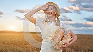 Female farmer standing wheat agricultural field Woman baker holding wicker basket bread product