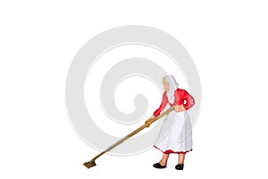 Female farmer at work with a rake isolated on white background