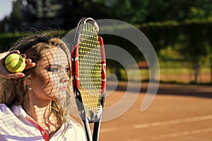 Female fashion, beauty and advertisement concept. Woman with net shadow on face on sunny day