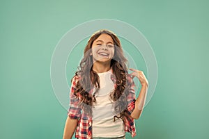 female fashion model. frizzy hair curl. girl has wavy hairdo. portrait of frizz child.