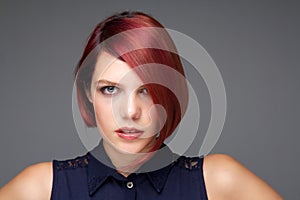 Female fashion model with short red hair