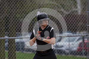 Female Fastpitch Softball Player In The Batters Box Sizing Up The Pitcher photo