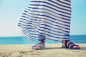 Female feet in billowing dress photo