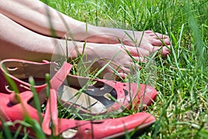 Female feet and grass