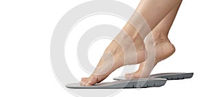 Female feet and insoles isolated on a white background