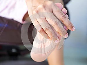 Female feet and soles of the heel with heel pain in adults and Treatment of Plantar Fasciitis. foot inflammatory ligament disease