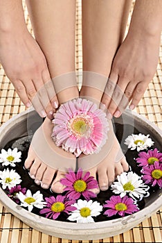 Female feet at spa salon on pedicure procedure