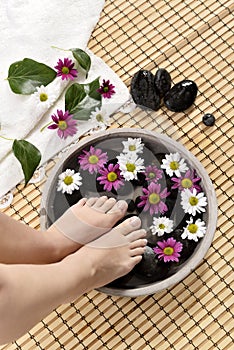 Female feet at spa salon on pedicure procedure