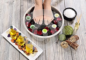 Female feet at spa salon on pedicure procedure