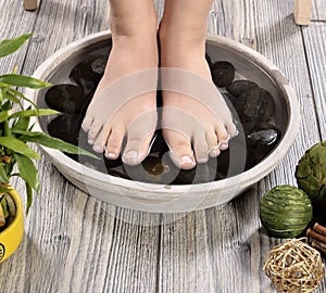Female feet at spa salon on pedicure procedure