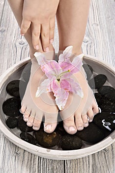 Female feet at spa salon on pedicure procedure