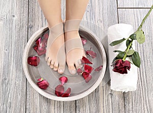 Female feet at spa salon on pedicure procedure