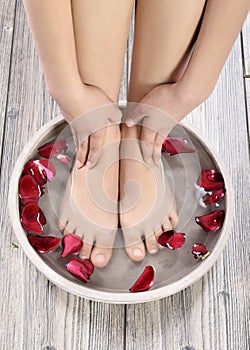 Female feet at spa salon on pedicure procedure