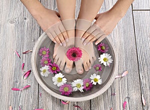 Female feet at spa salon on pedicure procedure