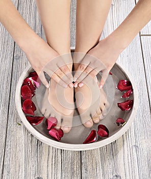 Female feet at spa salon on pedicure procedure