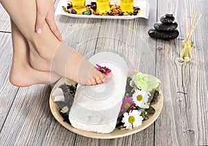 Female feet at spa salon on pedicure procedure