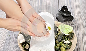 Female feet at spa salon on pedicure procedure