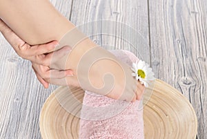 Female feet at spa salon on pedicure procedure