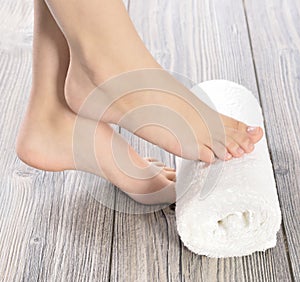 Female feet at spa salon on pedicure procedure photo