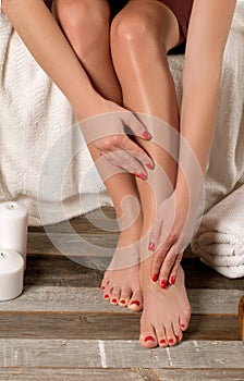 Female feet in spa salon, pedicure procedure